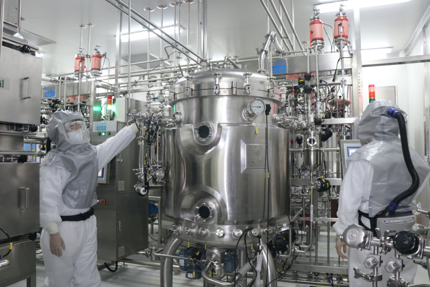 Workers tested equipment at a Sinopharm COVID-19 vaccine production facility before it starts production. Source: Sinopharm